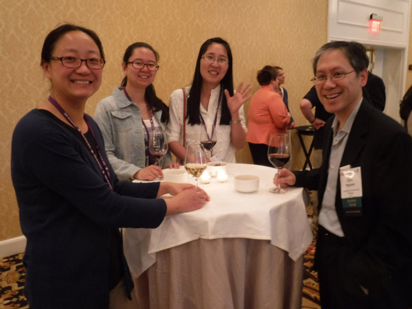 4 participants around table at WIE reception