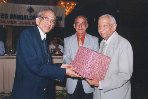 Mr Subramanian receiving the memento from  Prof. HNR Rao and Mr Sankaran