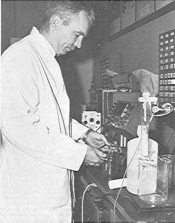 Above: O.Z. Roy conducting tests with heart pacer in saline
    solution.